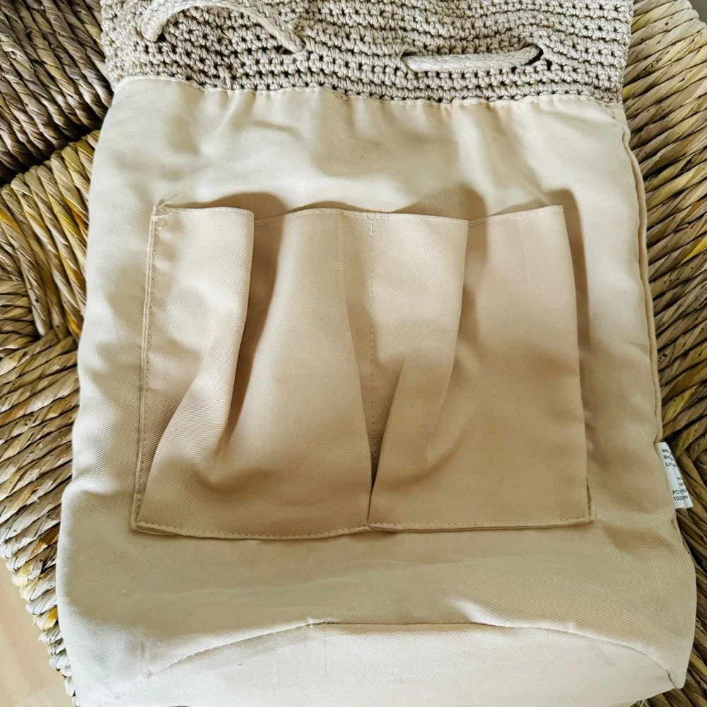 The Sak crochet drawstring backpack with zip pocket